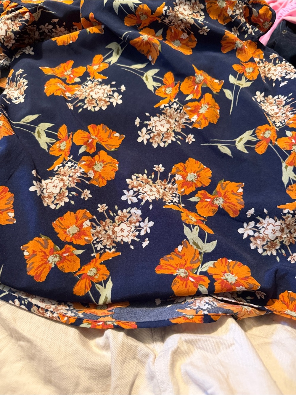 Navy Floral Blouse with Orange Blooms and white shorts